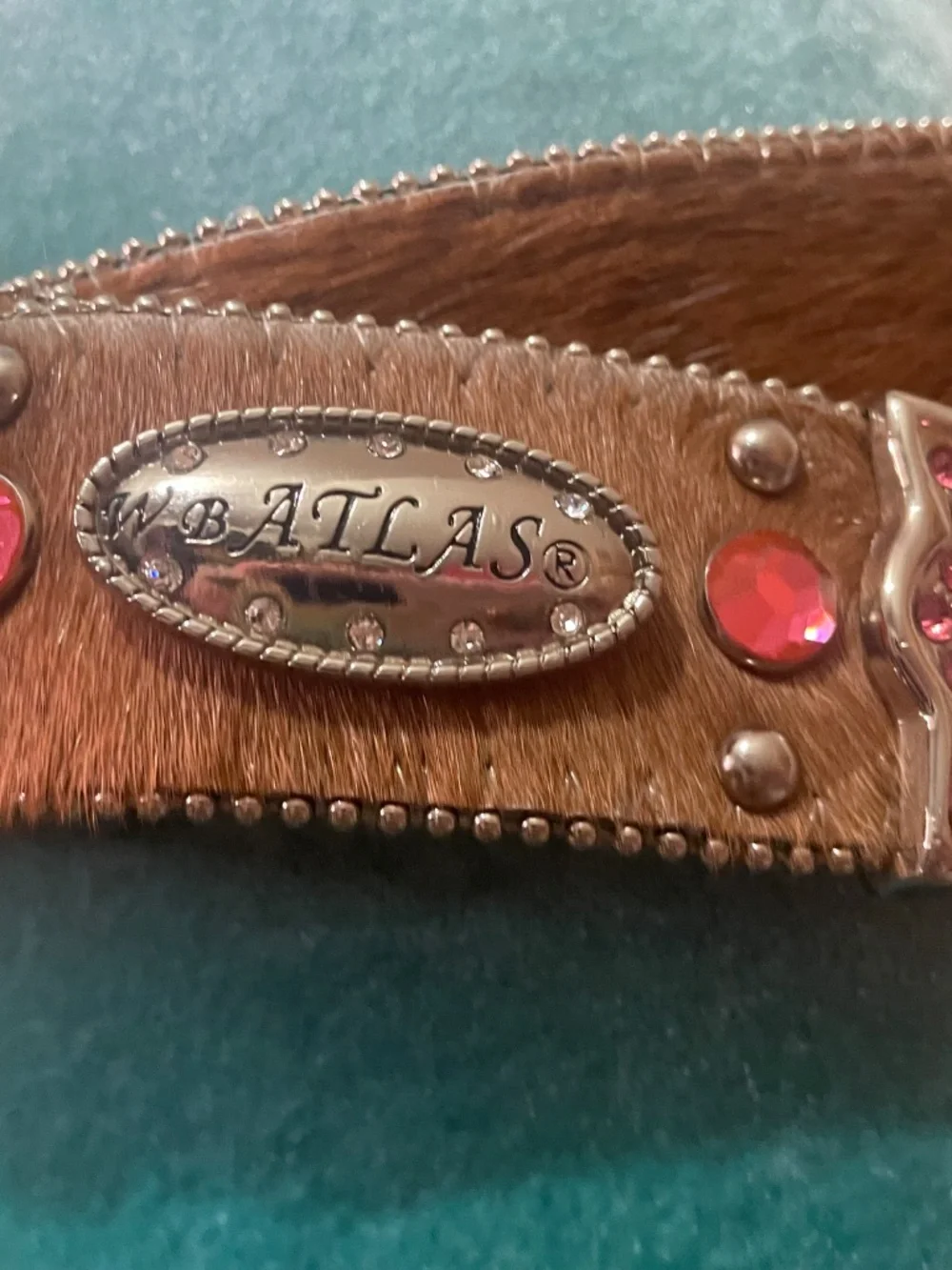 WB Atlas: Western-style belt featuring brown hair-on leather and pink crystals
